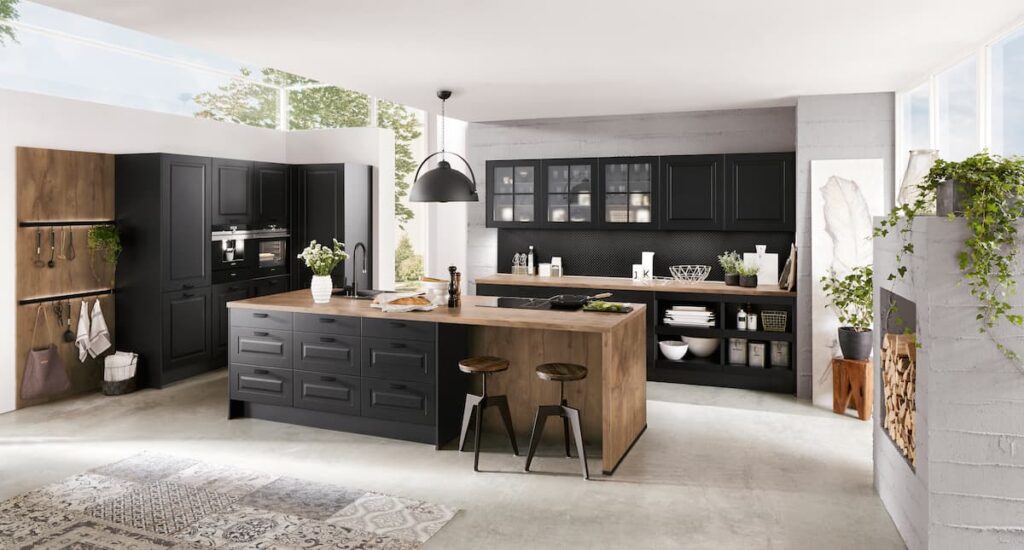 A modern black and wood kitchen, highlighting the elegance and functionality of a luxury kitchen space.