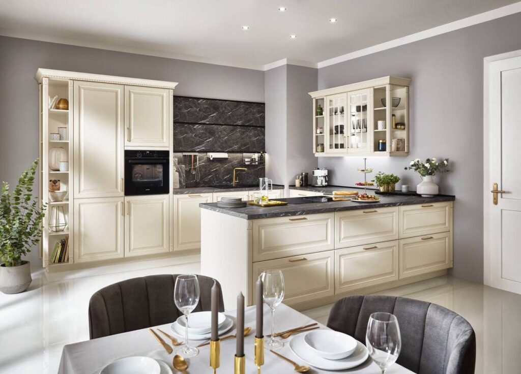 Classic white kitchen set with elegant cabinetry and dark marble countertops, showcasing interior design magic.