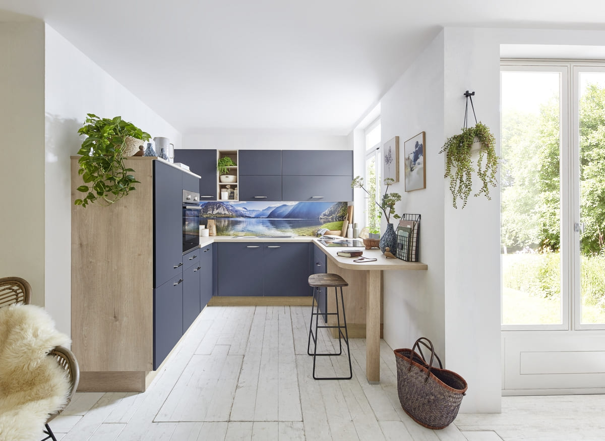 Cozy navy blue kitchen in Bangkok with nature-inspired decor creating a serene and inviting atmosphere.