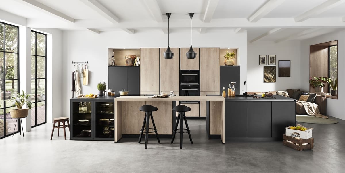A spacious German kitchen showcasing a combination of wood and matte black finishes.