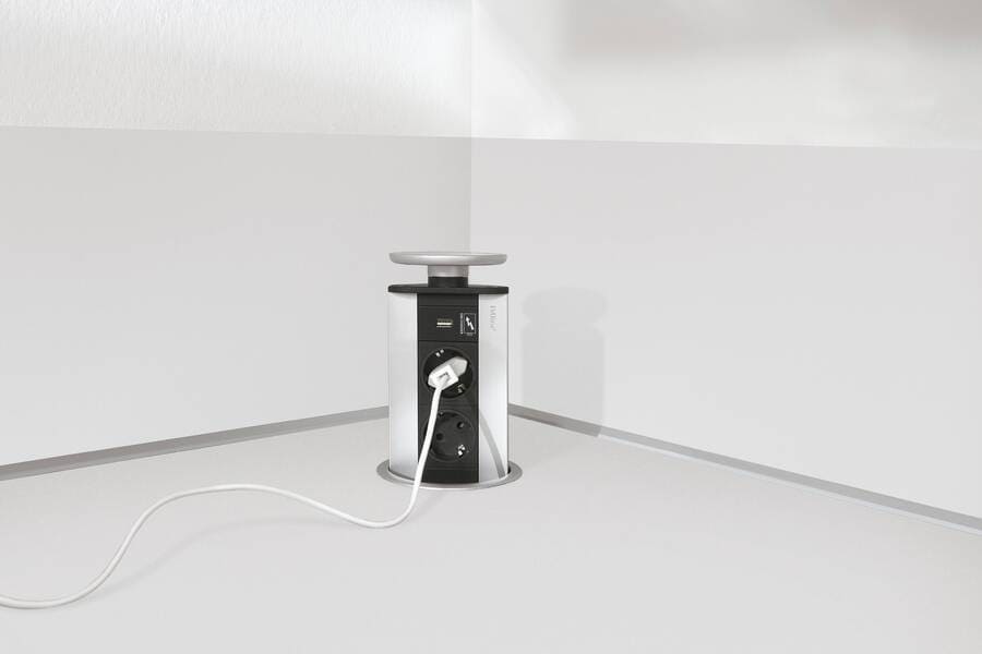 This pop-up power outlet offers a discreet way to manage electrical connections and hide appliances in a kitchen when not in use.