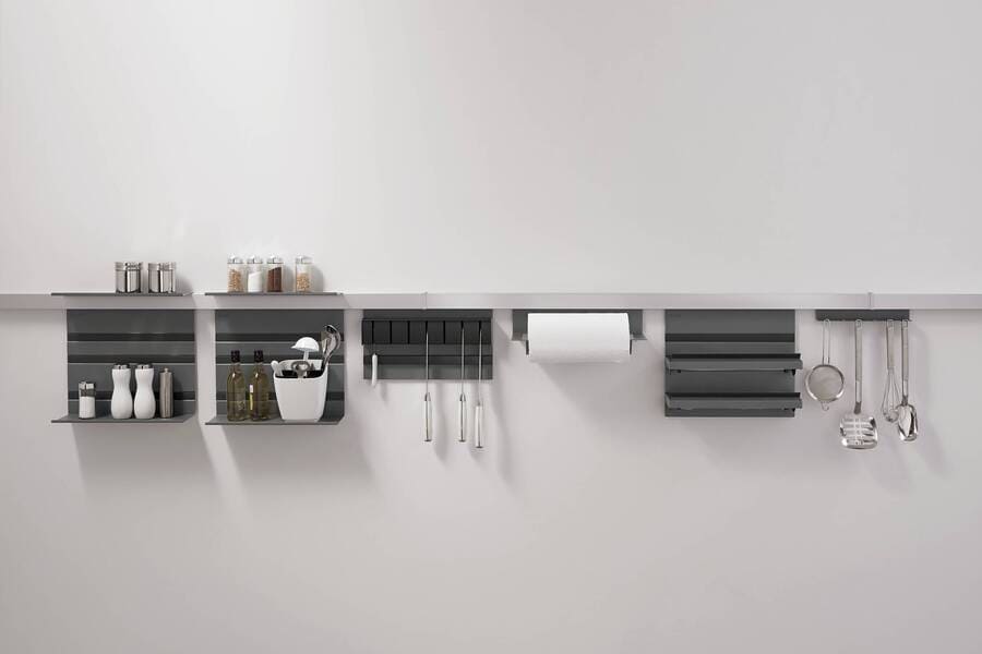 A clever wall-mounted storage system, offering a solution for how to hide appliances in a kitchen while keeping them accessible.