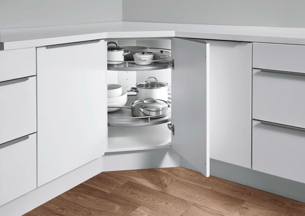 his white kitchen showcases practical kitchen interior design with a corner cabinet lazy susan, optimizing storage space.