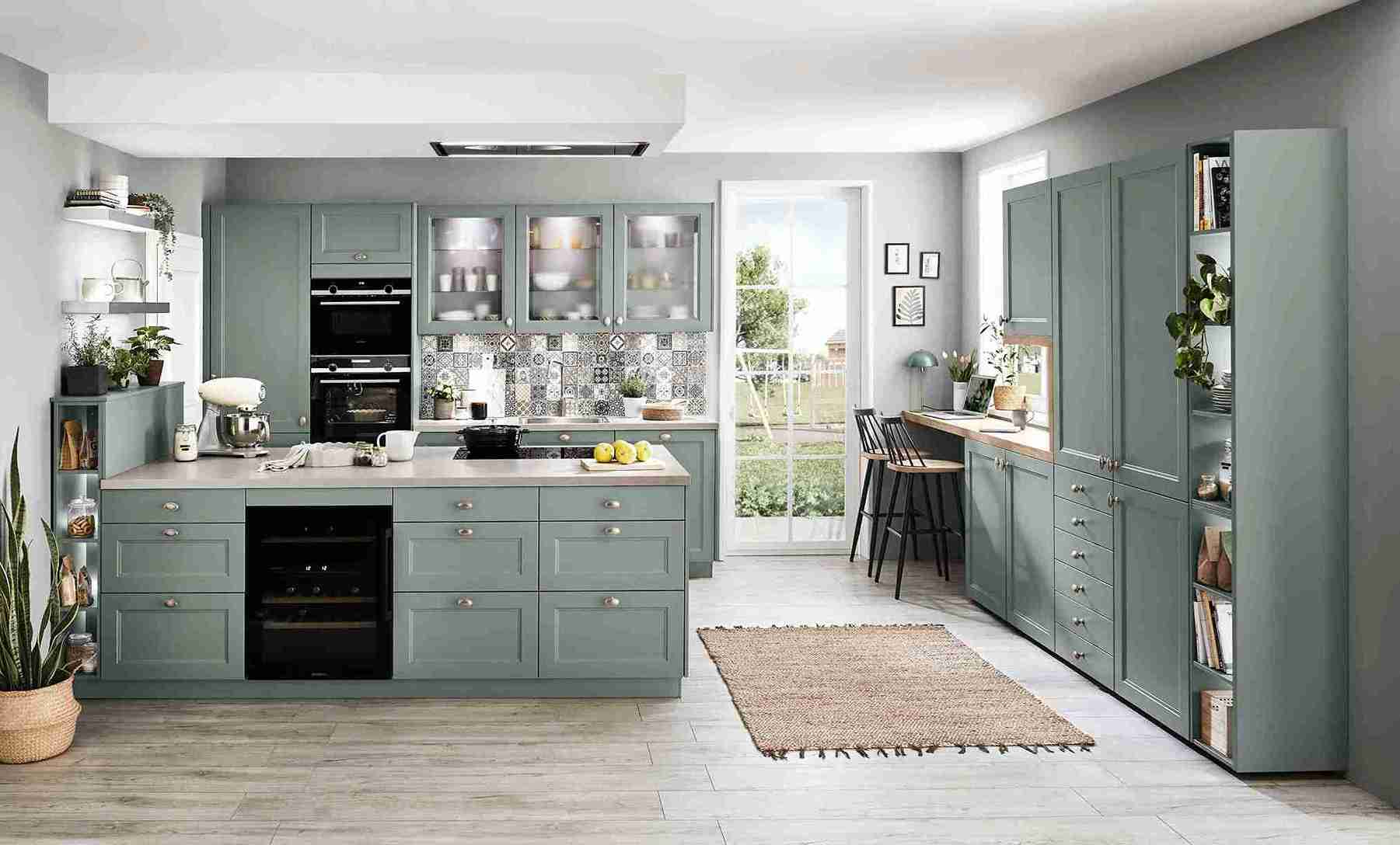 This green shaker kitchen offers kitchen design tips for creating a functional and stylish space. The island provides ample workspace and storage.