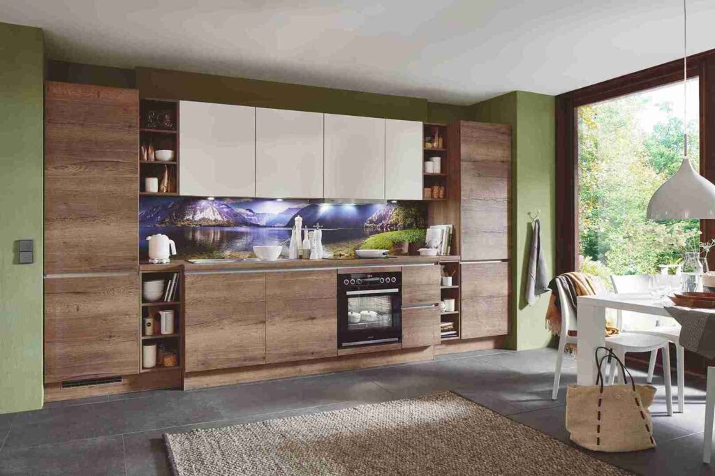 Gather kitchen design tips from this nature-inspired space, featuring wood cabinets, a scenic backsplash, and pops of white. Note the mix of open and closed storage.