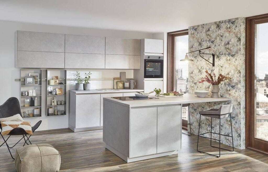 A modern grey kitchen with a floral feature wall. Understanding how to draw a kitchen floor plan helps visualize the placement of cabinets, appliances, and decorative elements.