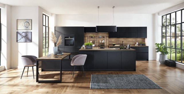 Contemporary luxury kitchen interior design featuring sleek black cabinets, a wooden backsplash, and a stylish dining area, showcasing modern elegance and functionality.