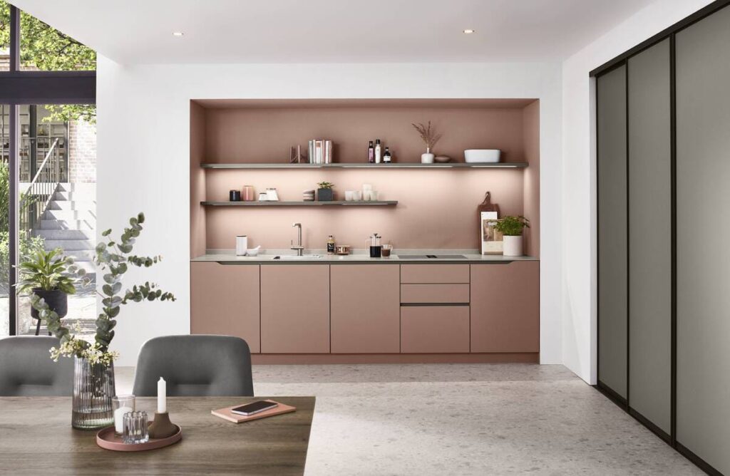 Minimalist pink built-in kitchen furniture design with open shelving and modern aesthetics.