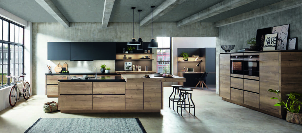 Modern industrial kitchen design in Bangkok with wooden cabinets, an island, and sleek decor.