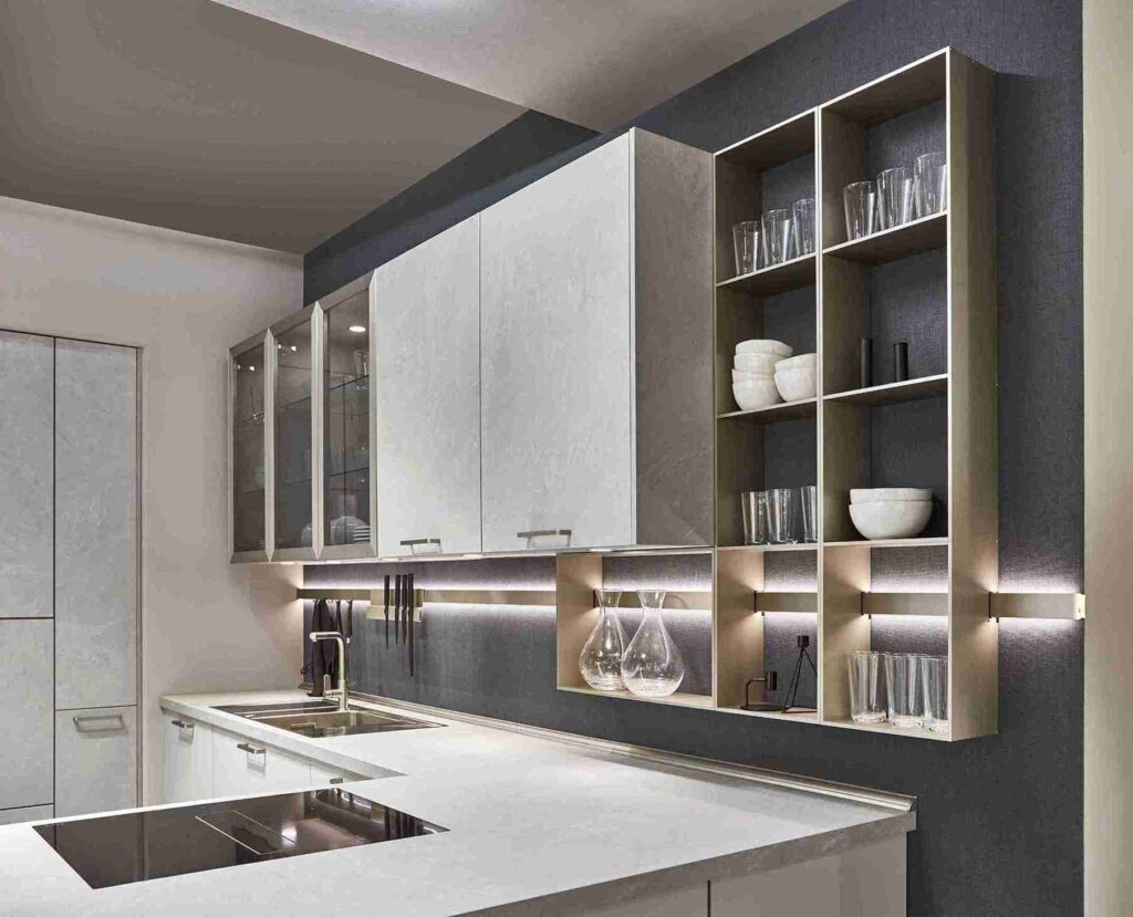 Find kitchen design tips in this detail shot of a modern kitchen, highlighting the use of metal shelving and integrated lighting.