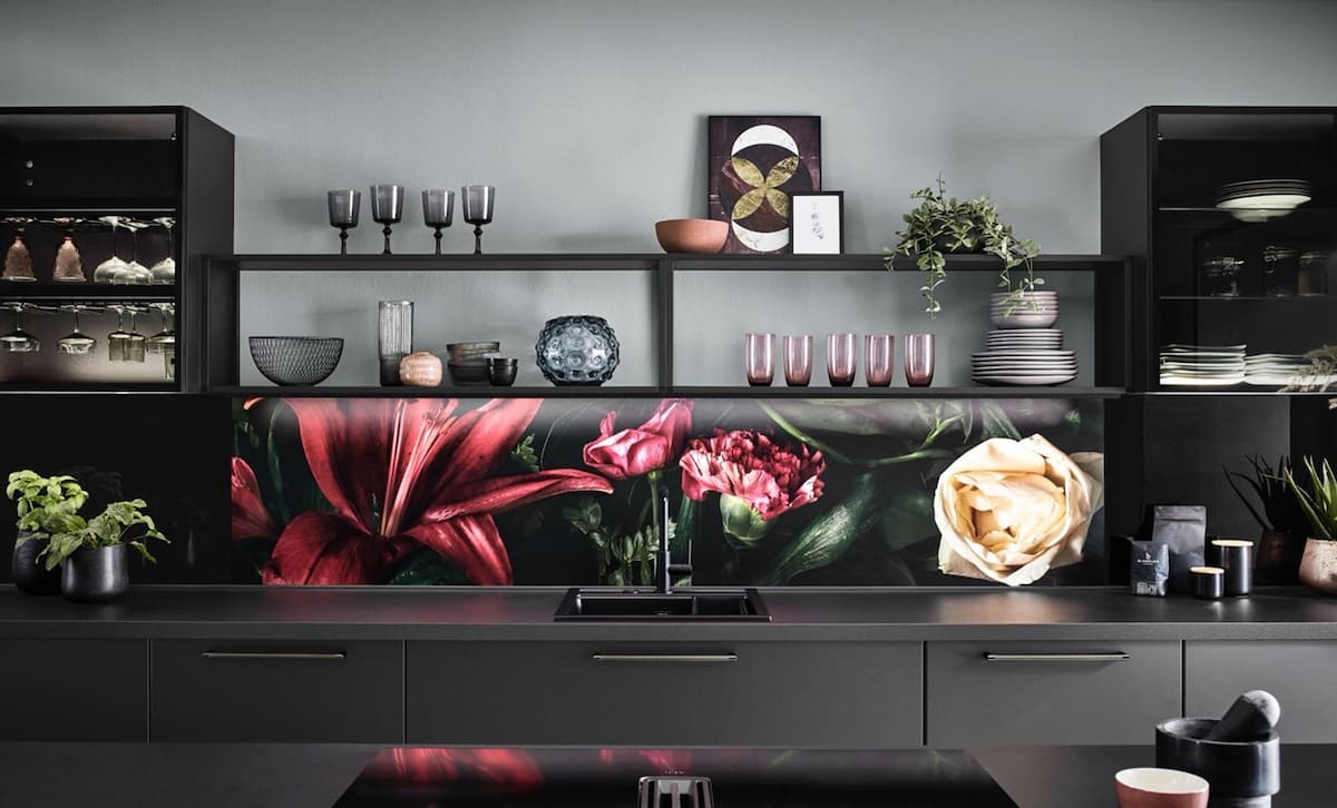 Modern kitchen with a striking floral tile backsplash, showcasing how tiles can create a dramatic focal point.