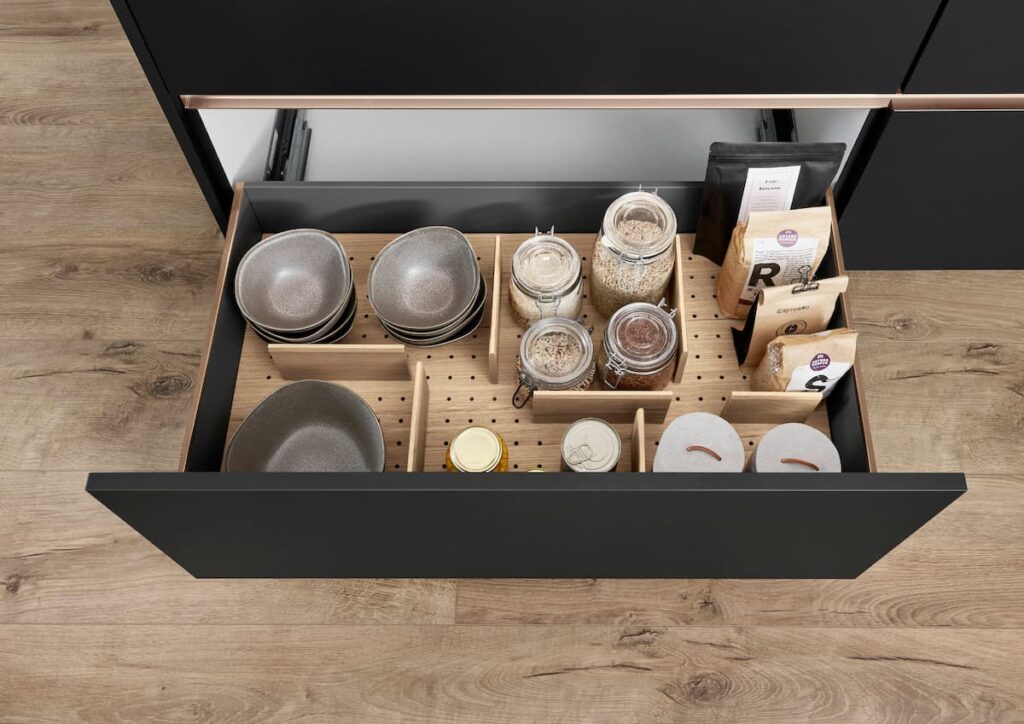 The nBOX: a sleek, organized kitchen drawer with built-in dividers and storage solutions, perfect for modern kitchens in Bangkok featuring tailored built-in kitchen furniture.
