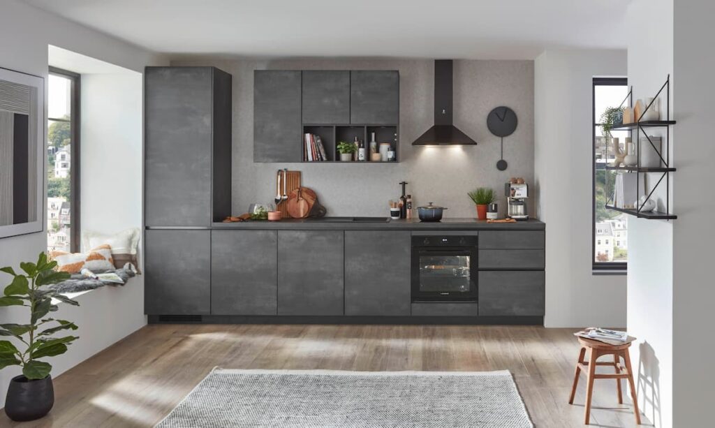 A modern industrial kitchen featuring urban grey modular cabinets, crafted from the best material for modular kitchen cabinets for a durable yet stylish finish.
