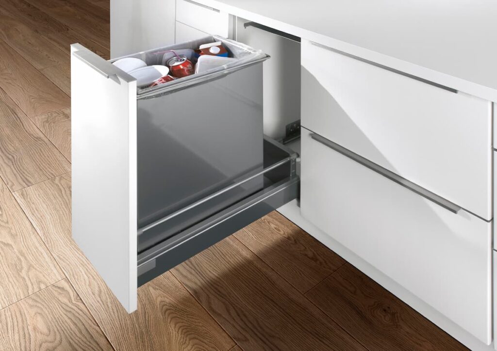 A kitchen waste drawer with bins for recycling, emphasizing sustainable and eco-friendly waste management.