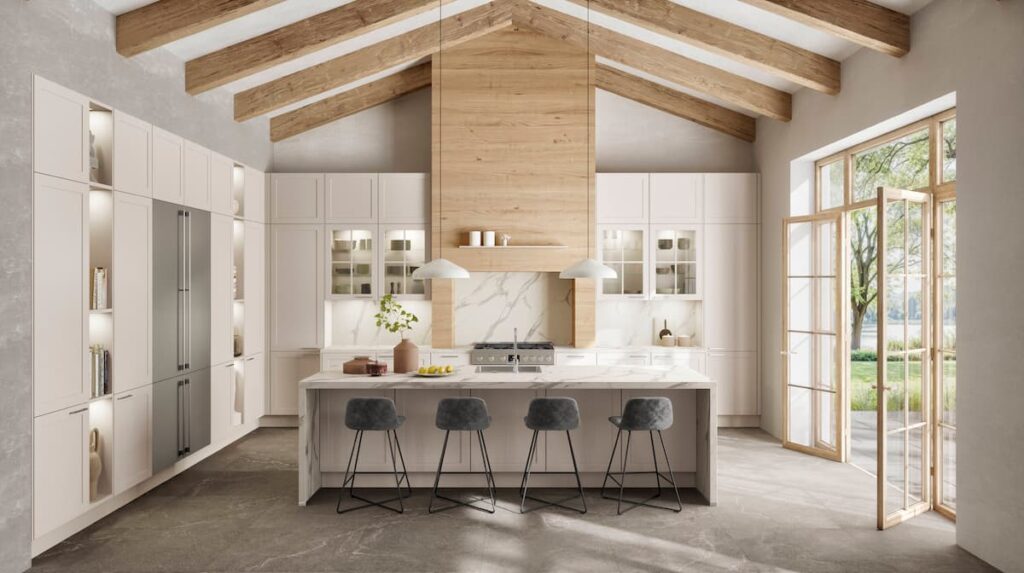 Expansive, light-filled kitchen with exposed wooden beams and a large marble island, representing the height of luxury country kitchens.