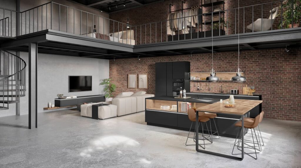 Industrial style kitchen with exposed brick wall and matte black island featuring natural living wood accents.
